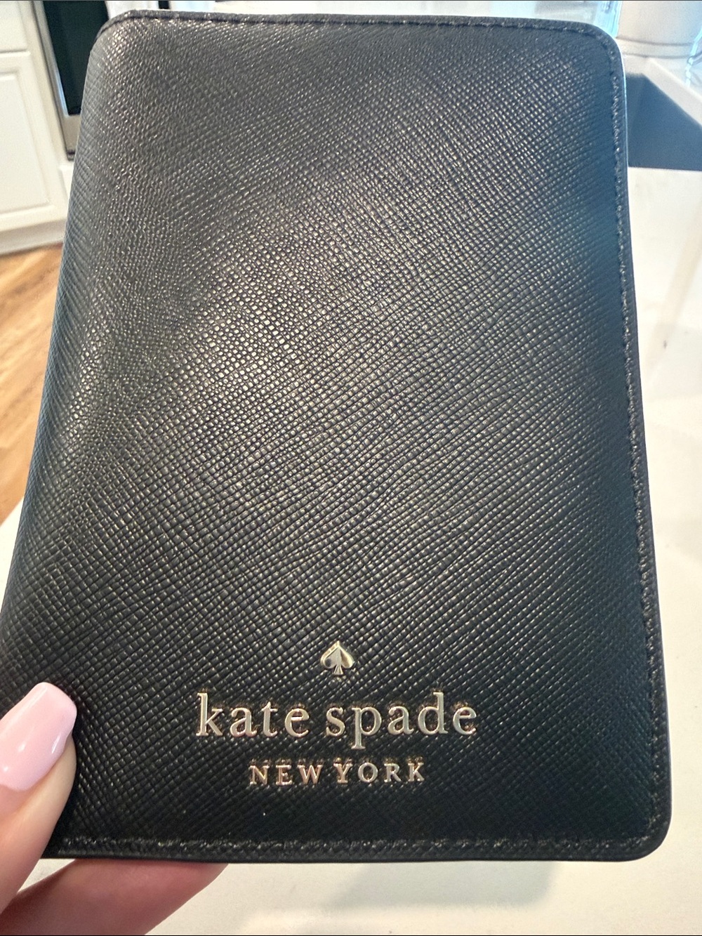 kate spade black passport wallet with gold logo